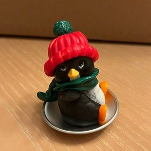 Vintage Hallmark Merry Miniature Christmas sledding penguin.